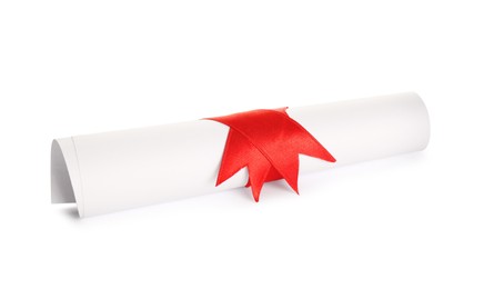 Photo of Rolled student's diploma with red ribbon isolated on white