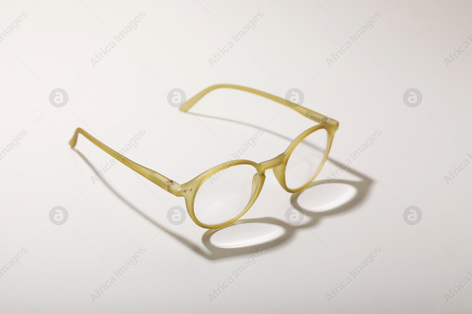 Photo of Glasses with corrective lenses on white background