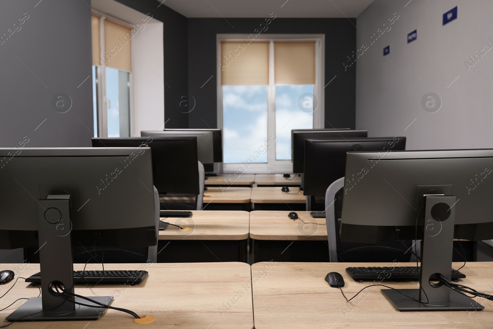 Photo of Many modern computers in open space office