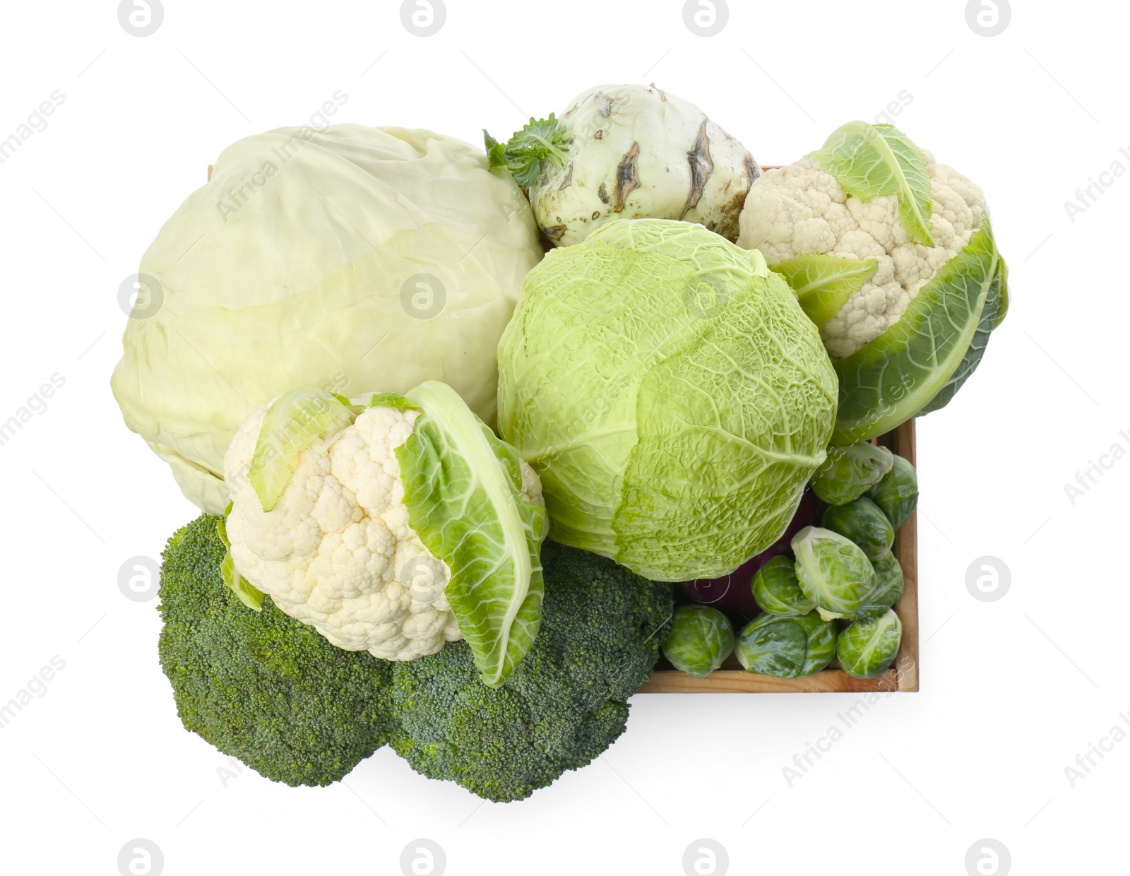 Photo of Wooden crate with different types of fresh cabbage on white background, top view