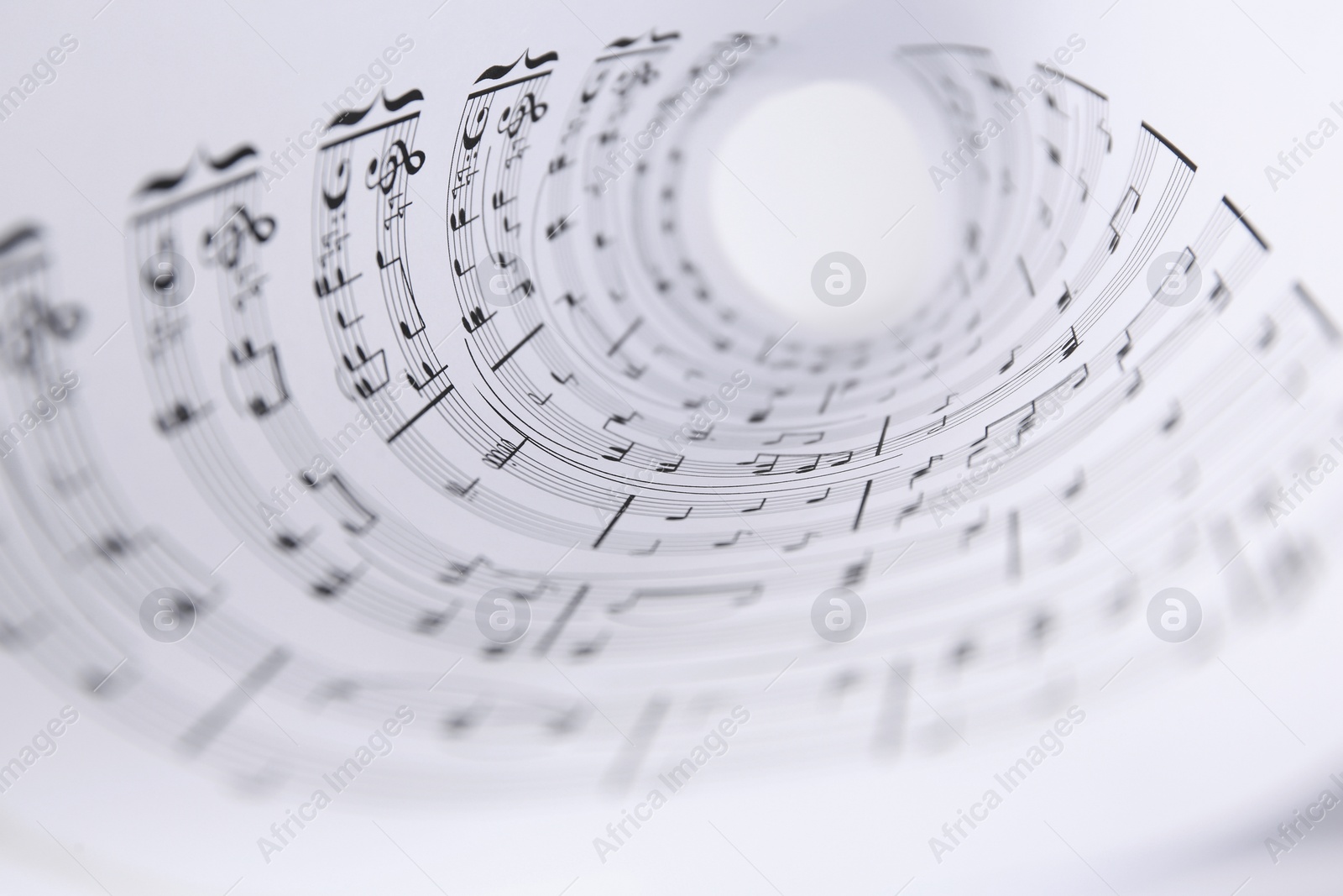 Photo of Rolled sheet with music notes, closeup view