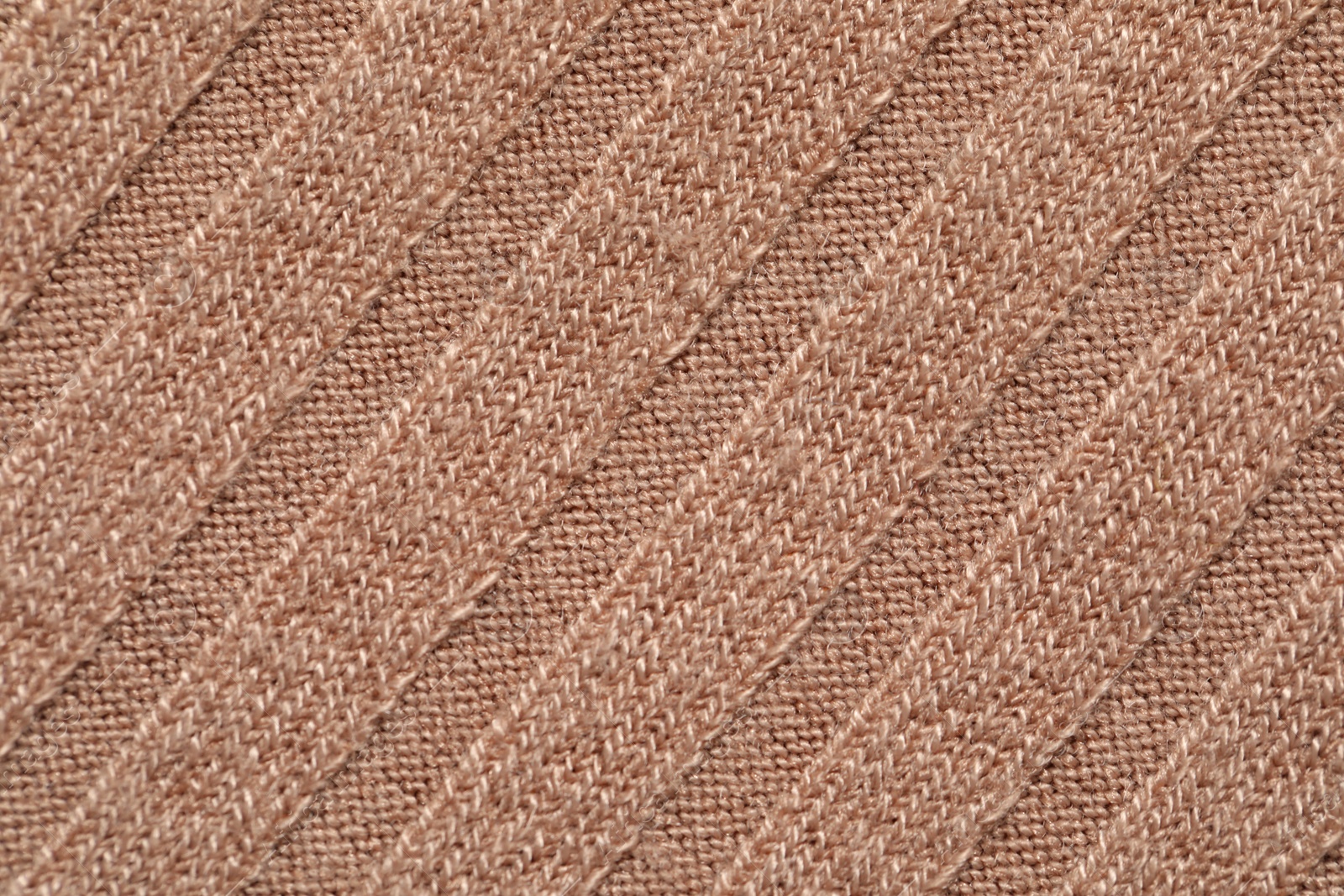 Photo of Texture of soft beige fabric as background, top view