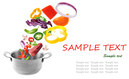 Pot and fresh ingredients for soup on white background. Space for text