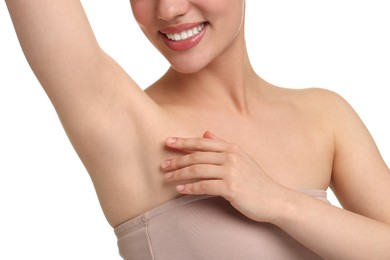 Beautiful woman showing armpit with smooth clean skin on white background