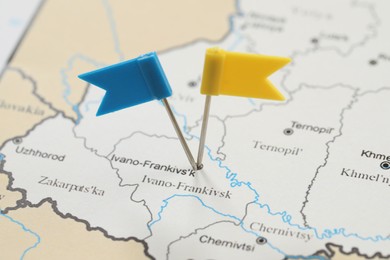 MYKOLAIV, UKRAINE - NOVEMBER 09, 2020: Ivano-Frankivsk city marked with push pins on contour map of Ukraine, closeup