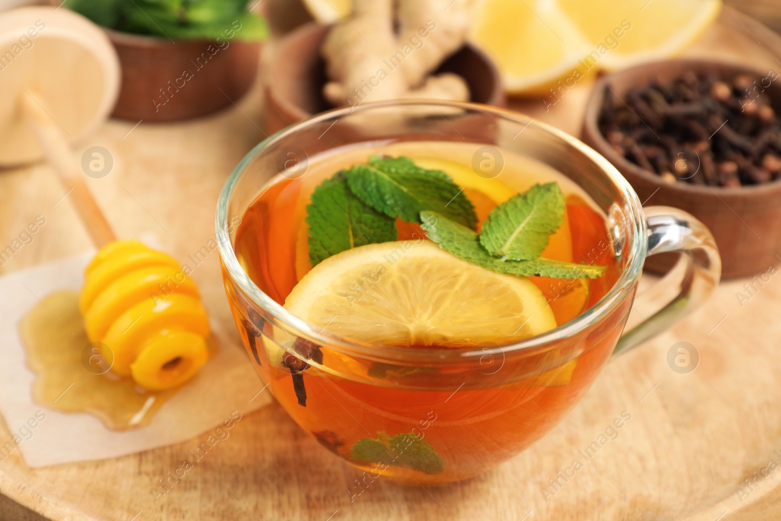 Photo of Immunity boosting drink and ingredients on wooden tray