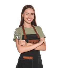 Photo of Portrait of happy hairdresser with professional scissors on white background