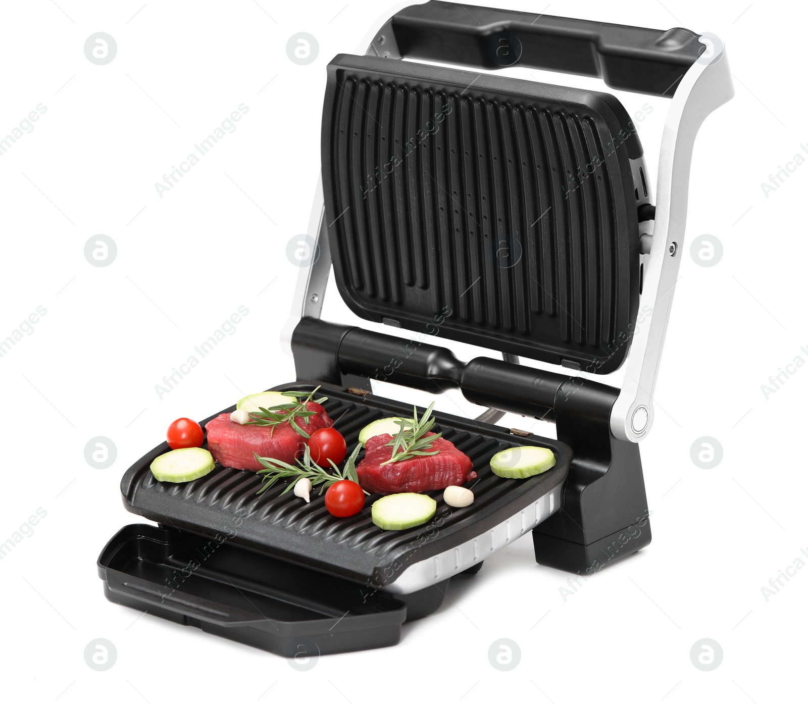 Photo of Electric grill with raw meat, rosemary and vegetables isolated on white