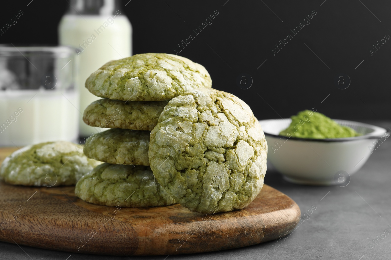 Photo of Tasty matcha cookies on grey table, closeup