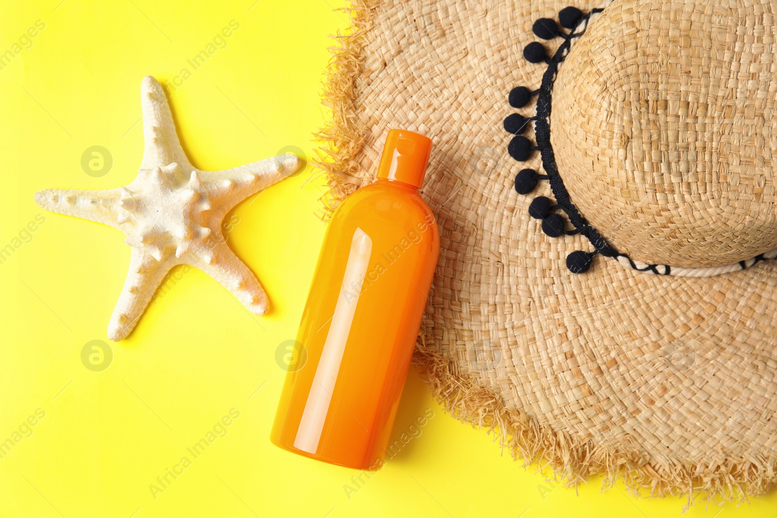 Photo of Flat lay composition with sun protection body cream on color background