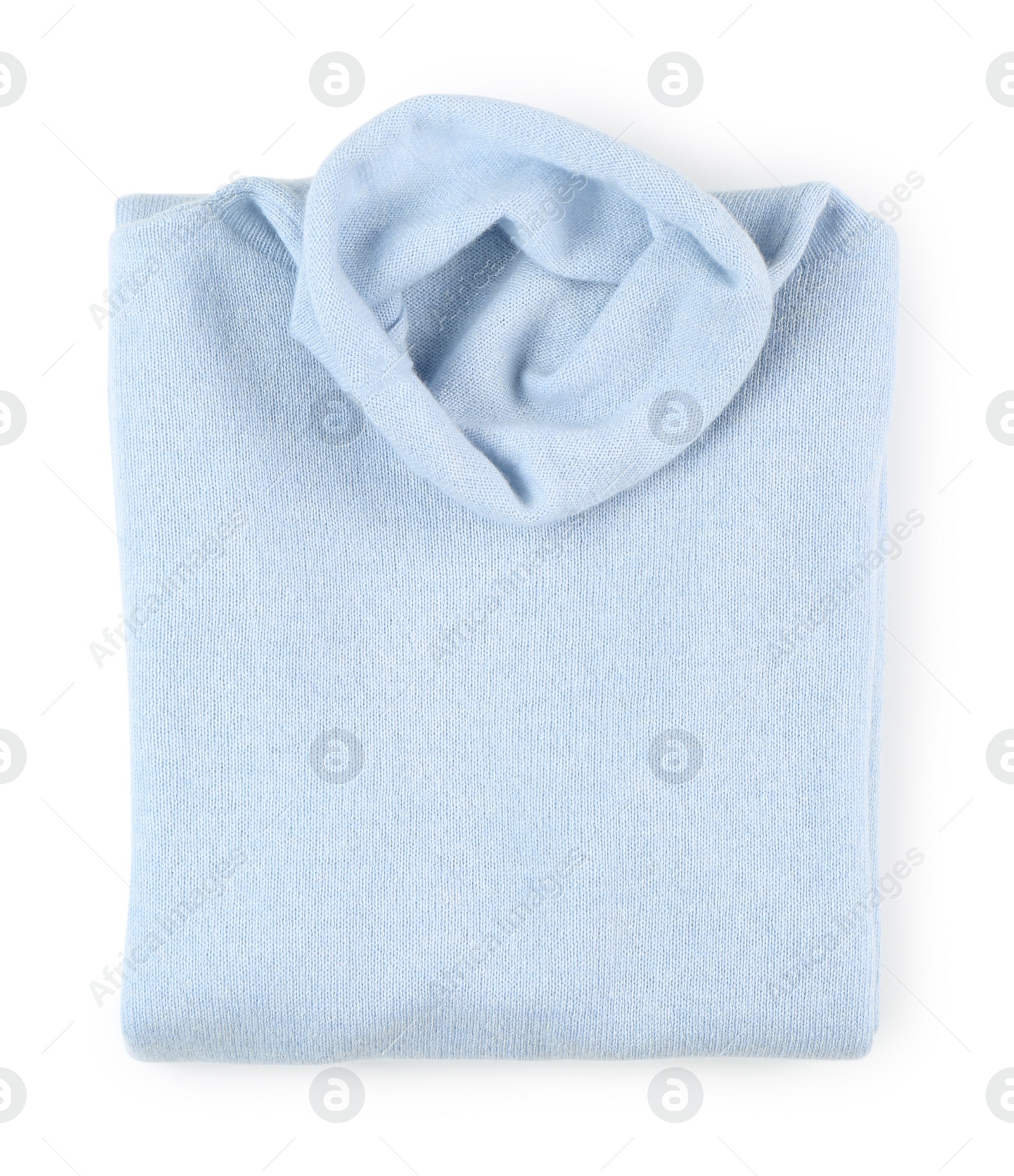 Photo of Folded light blue cashmere sweater isolated on white, top view