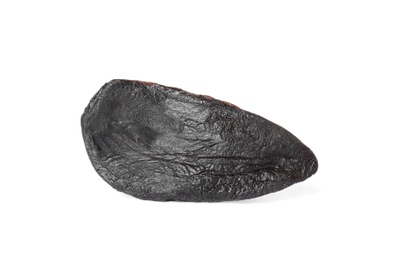 Clove of aged black garlic on white background