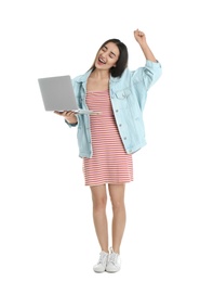 Photo of Full length portrait of happy young woman in casual outfit with laptop on white background
