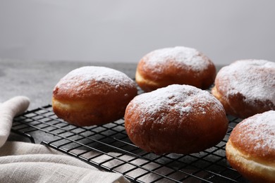 Delicious sweet buns on table against gray background, closeup