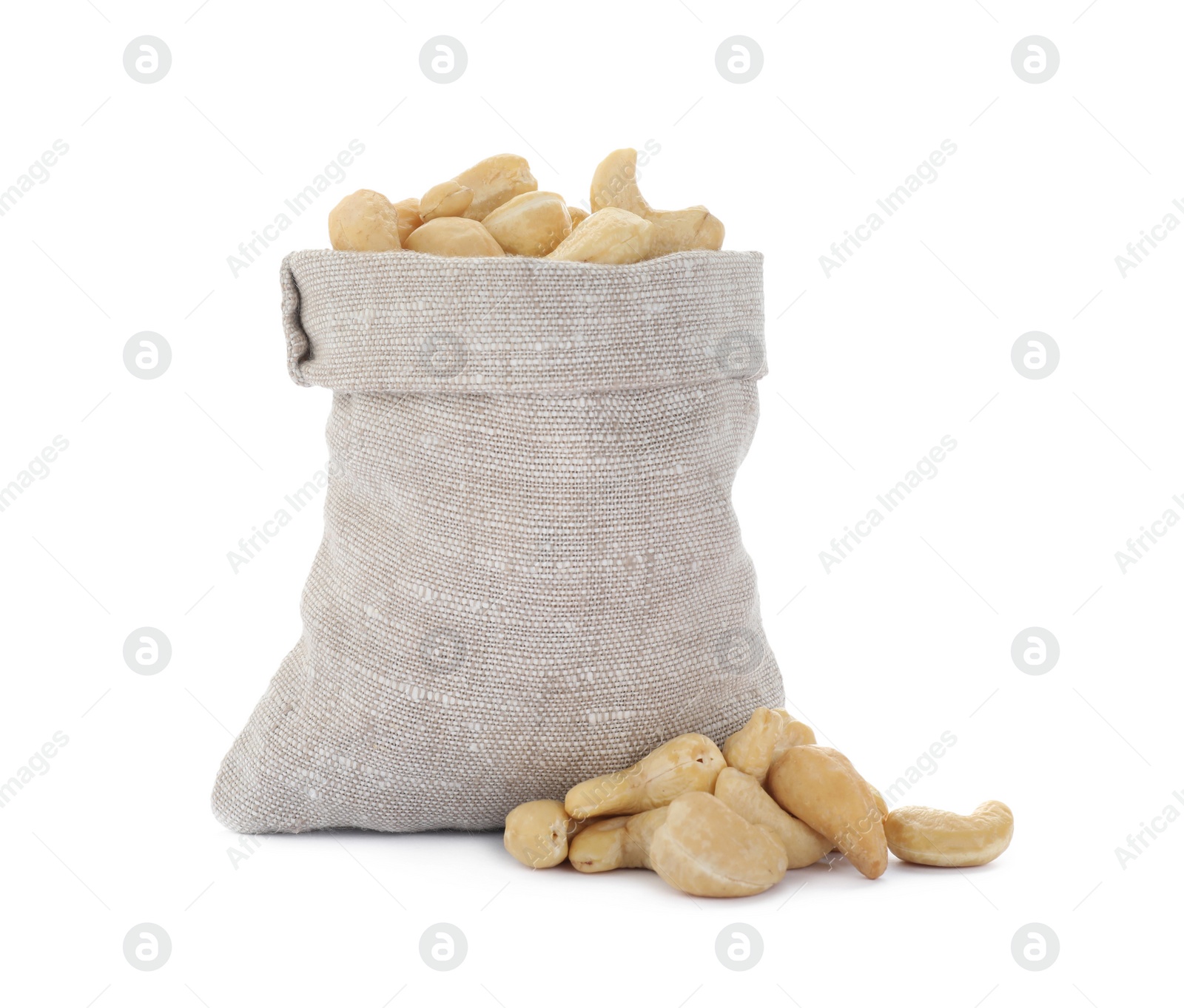 Photo of Sack and tasty organic cashew nuts isolated on white
