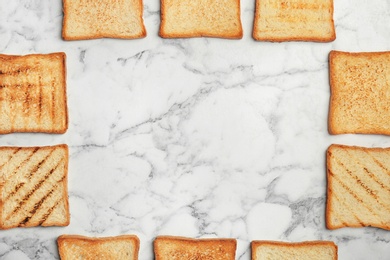 Photo of Flat lay composition with toasted bread on light background