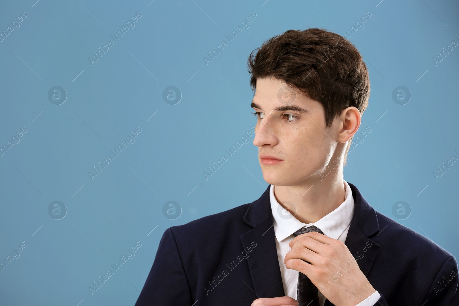 Photo of Portrait of young businessman with beautiful hair on color background