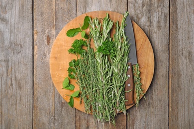 Flat lay composition with rosemary on table. Aromatic herbs