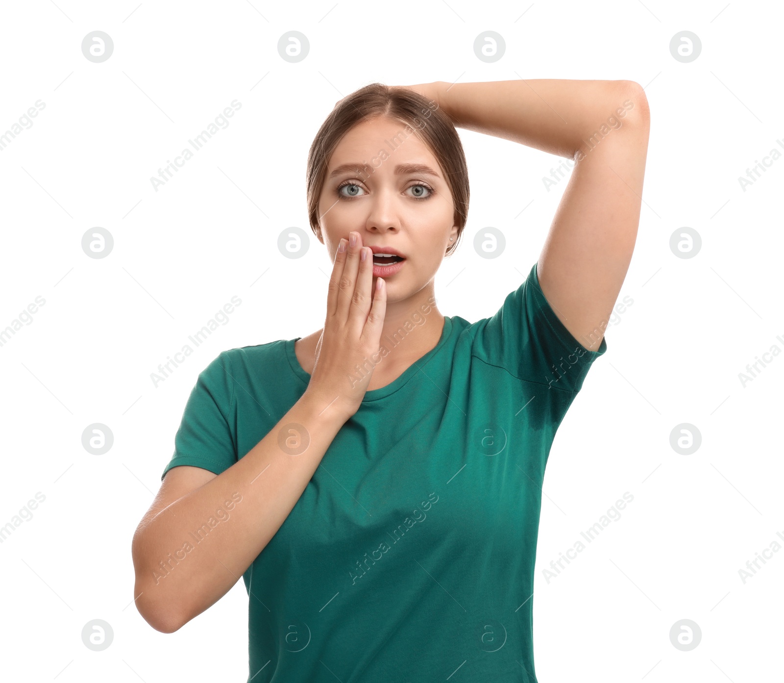 Photo of Young woman with sweat stain on her clothes against white background. Using deodorant