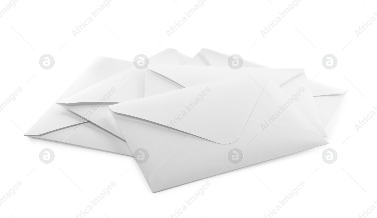 Photo of Heap of paper envelopes on white background