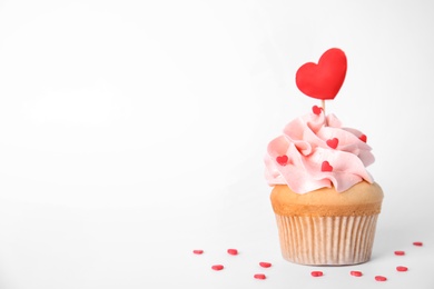 Photo of Tasty cupcake on white background. Valentine's Day celebration