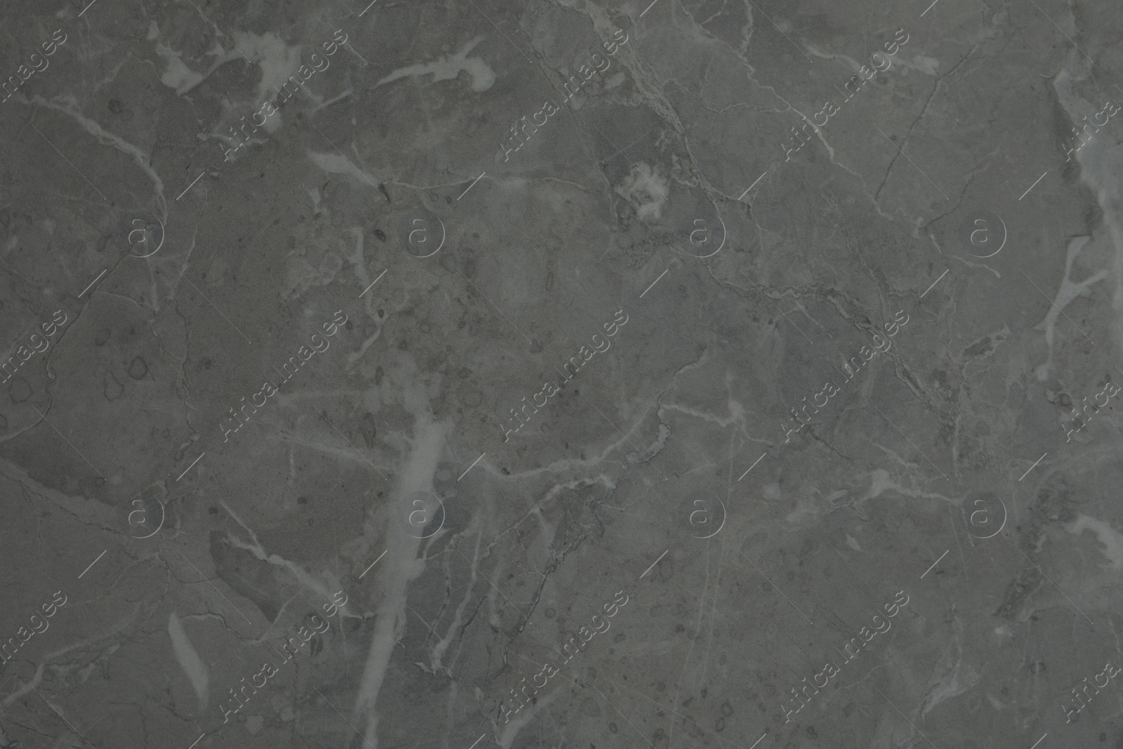 Photo of Texture of light grey marble surface as background, closeup