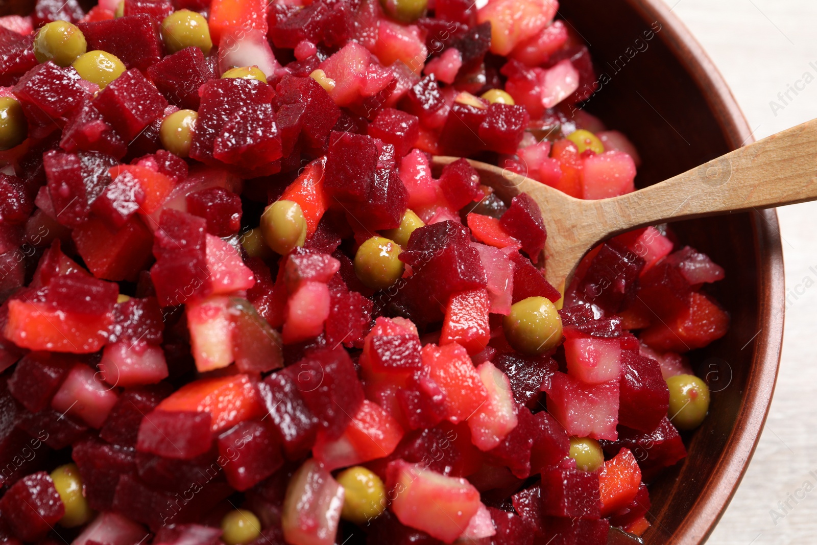 Photo of Delicious fresh vinaigrette salad in bowl, closeup