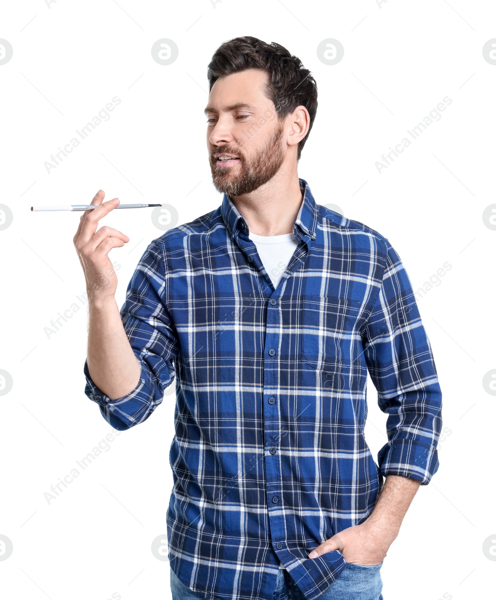 Photo of Man using long cigarette holder for smoking isolated on white