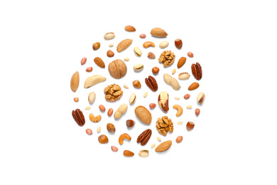 Different delicious nuts on white background, flat lay