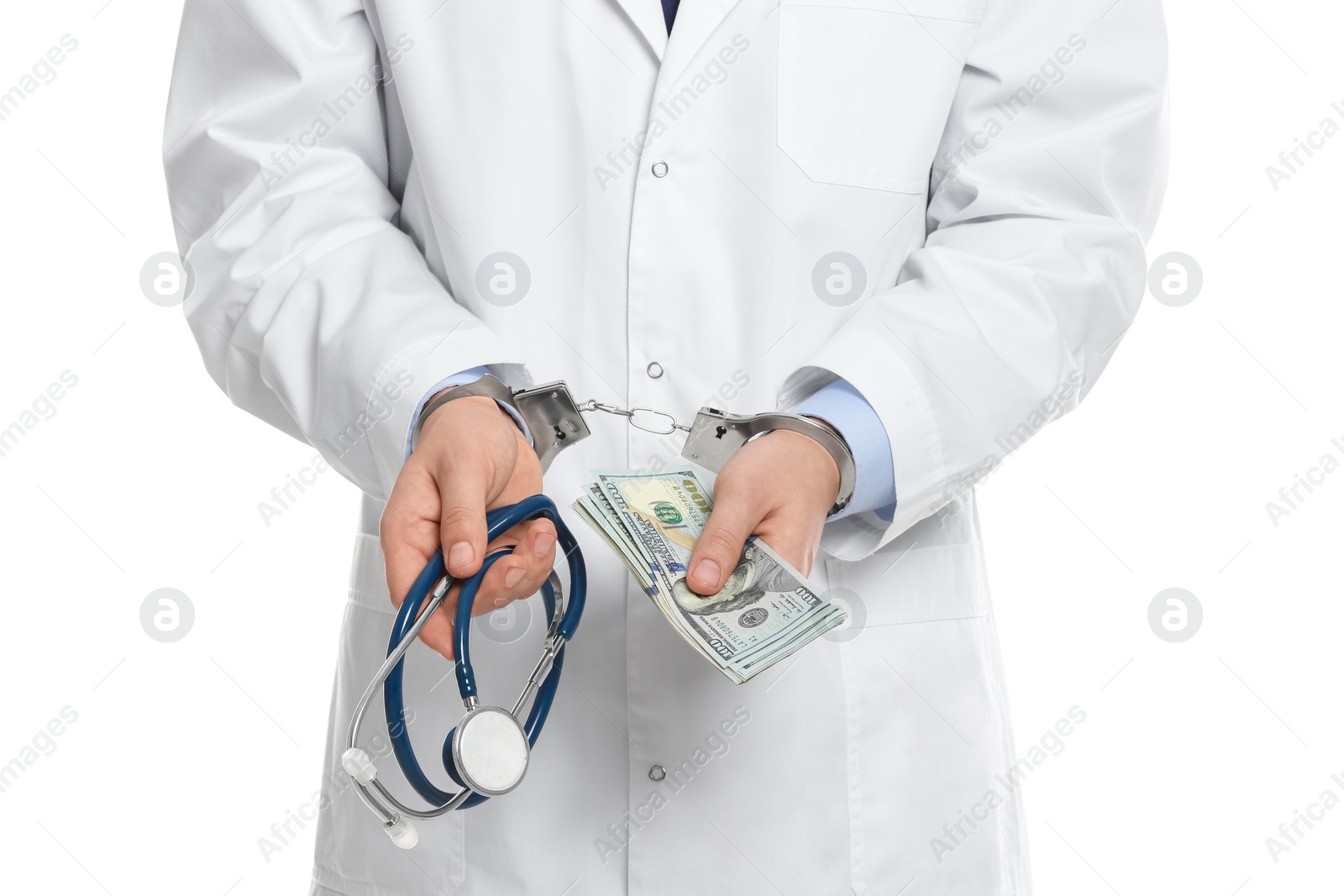 Photo of Doctor in handcuffs with bribe and stethoscope on white background, closeup. Corrupted medicine