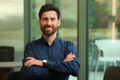 Photo of Portrait of handsome stylish man in cafe