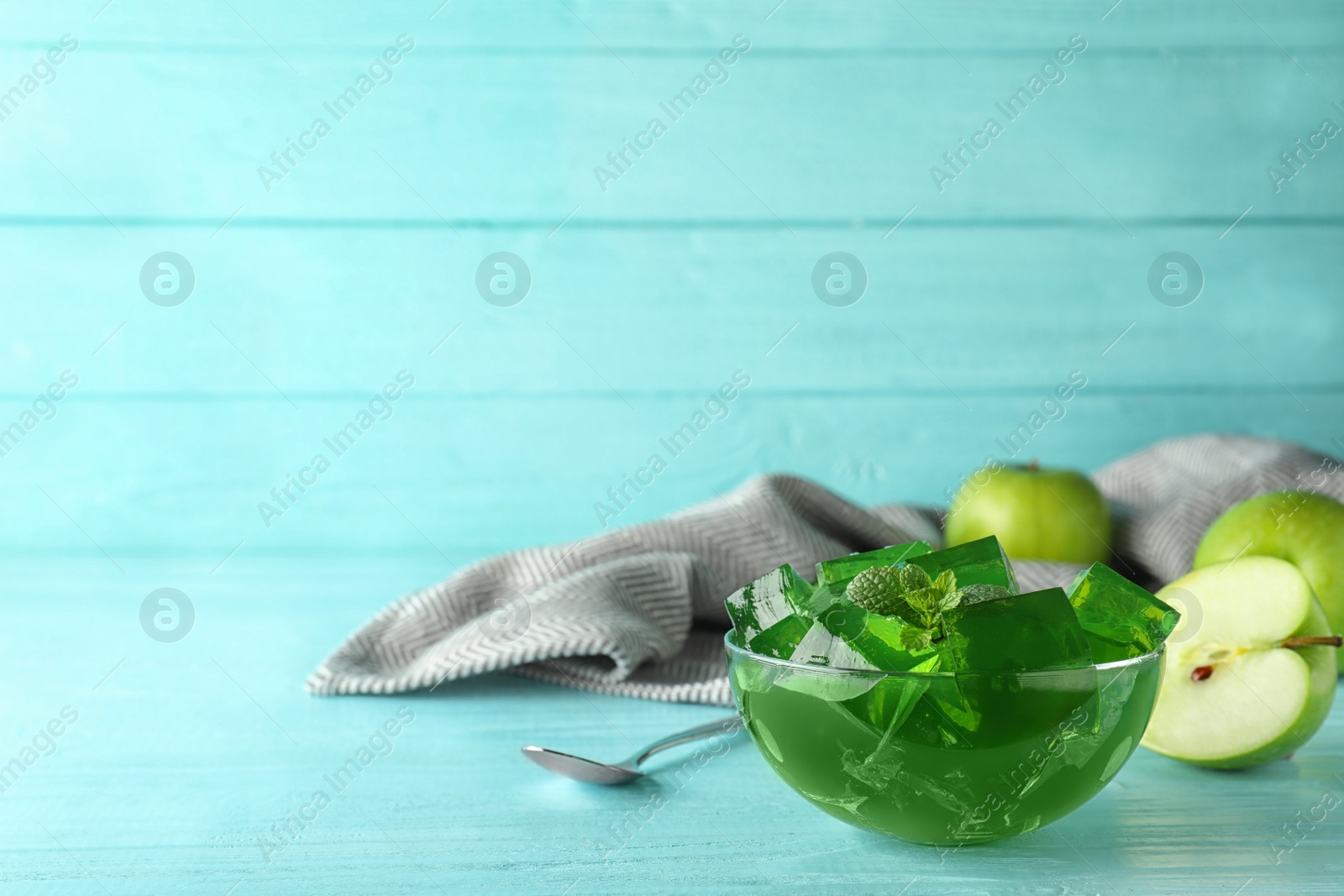 Photo of Bowl of tasty jelly on table. Space for text