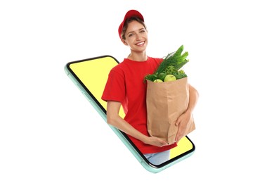 Image of Grocery shopping via internet. Delivery woman with bag full of products looking out huge smartphone on white background