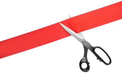 Photo of Ribbon and scissors on white background, top view