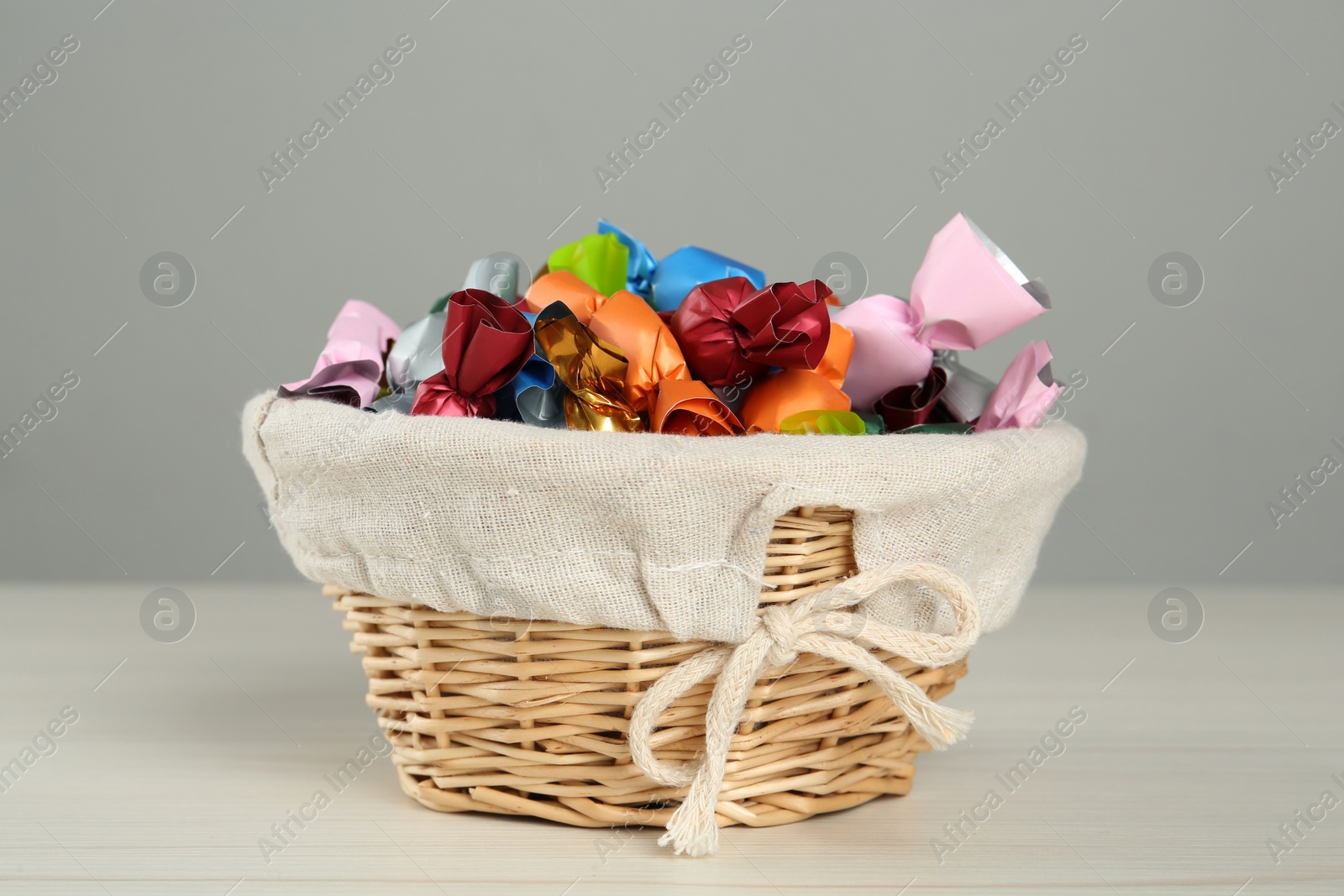 Photo of Candies in colorful wrappers on light table