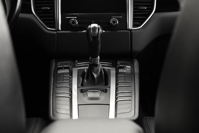 Photo of Gear stick inside of modern black car