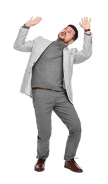 Emotional bearded businessman in suit evading something on white background