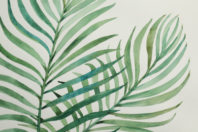 Photo of Beautiful watercolor tropical leaves painted on white paper, top view