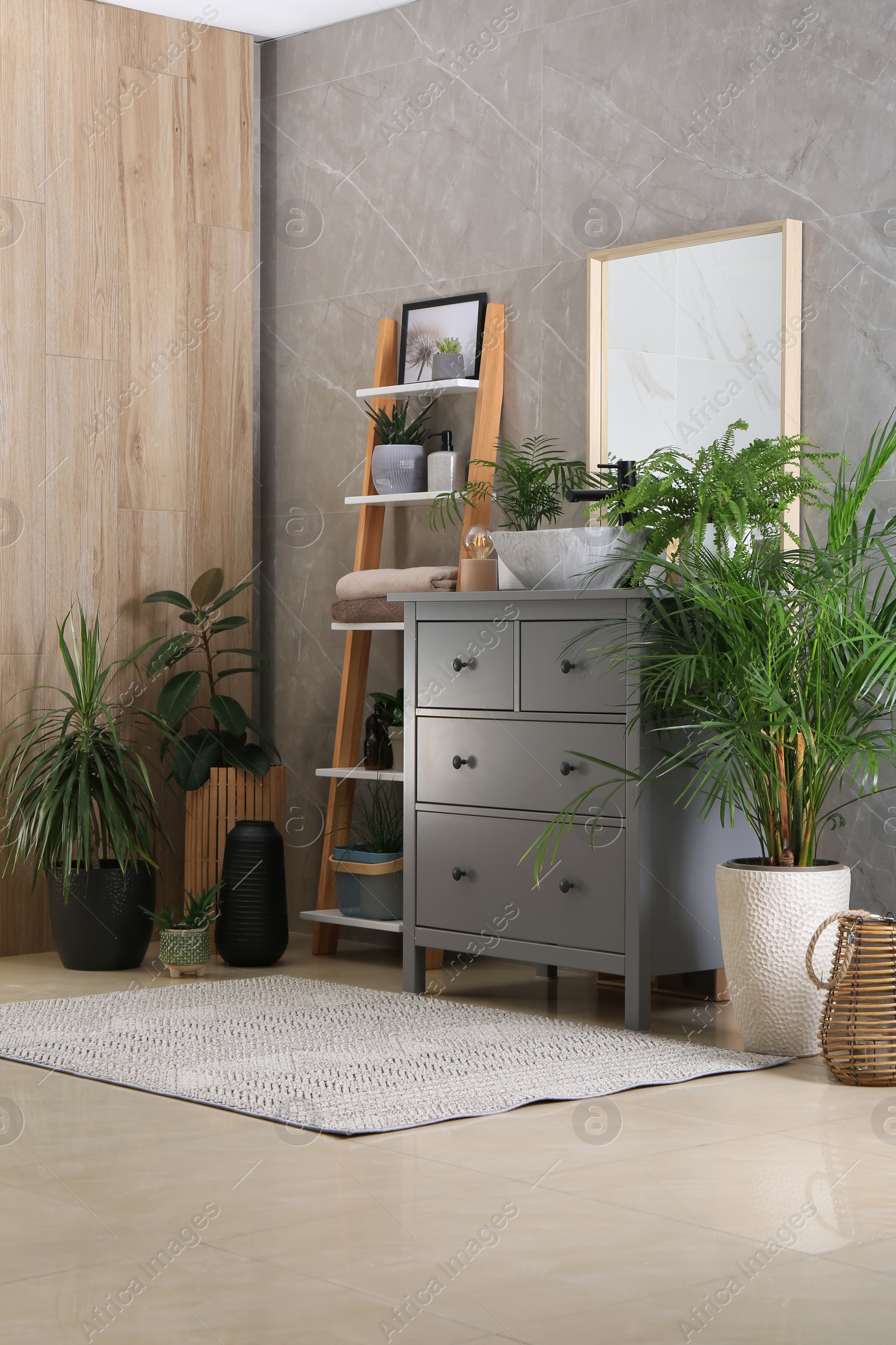 Photo of Modern bathroom interior with stylish vessel sink and beautiful green houseplants