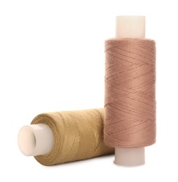 Different colorful sewing threads on white background