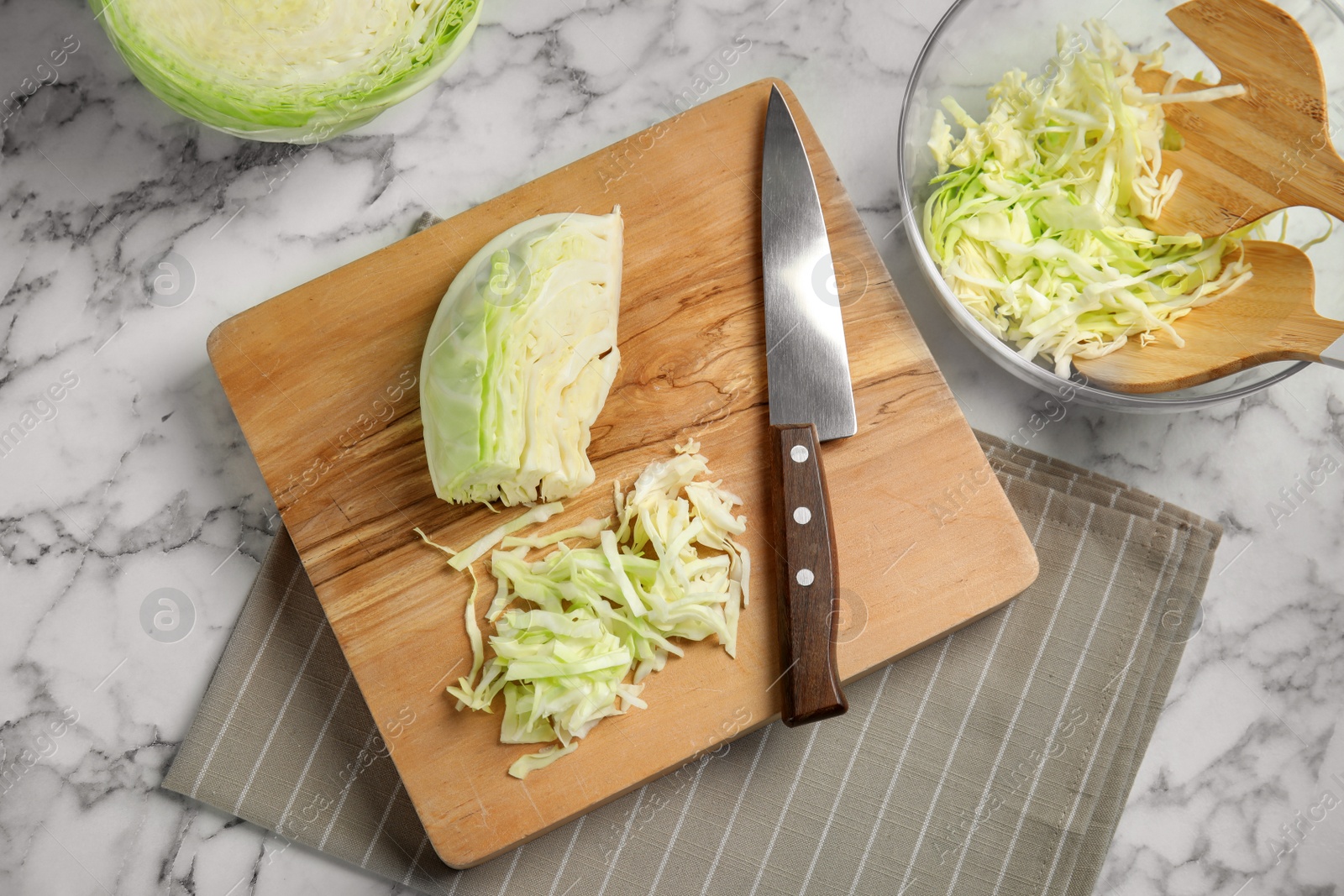 Photo of Flat lay composition with cut cabbage on table