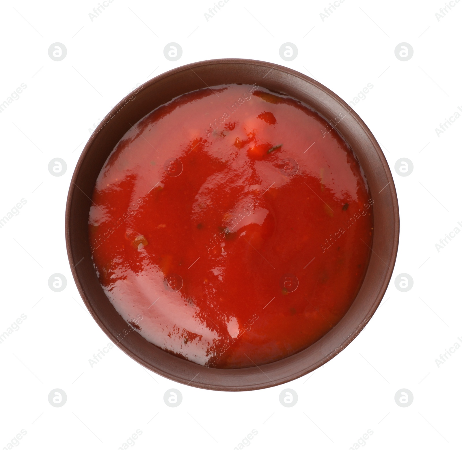 Photo of Bowl of spicy chili sauce on white background, top view