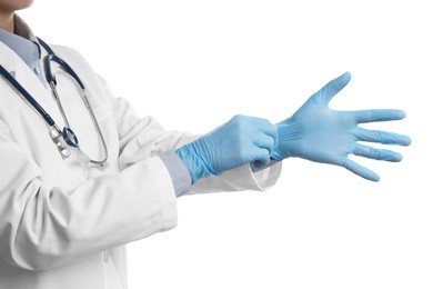 Photo of Doctor wearing light blue medical gloves on white background, closeup