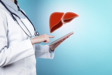 Image of Doctor with tablet and illustration of healthy liver on light blue background, closeup