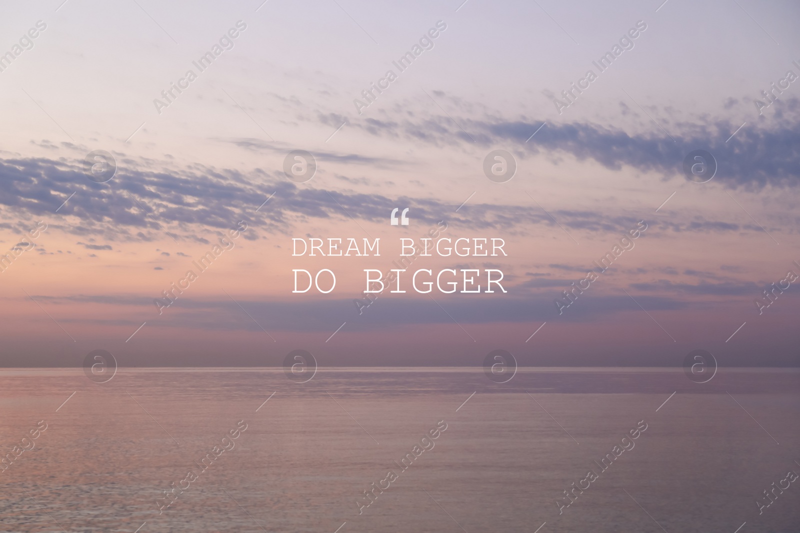 Image of Dream Bigger Do Bigger. Inspirational quote motivating to set life goals freely and forget about reasons that can hold back. Text against seascape in morning