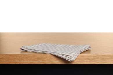 Photo of Checkered tablecloth on wooden table against white background