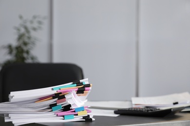 Stack of documents with paper clips on office table. Space for text