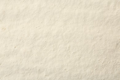 Photo of Texture of baking powder as background, top view