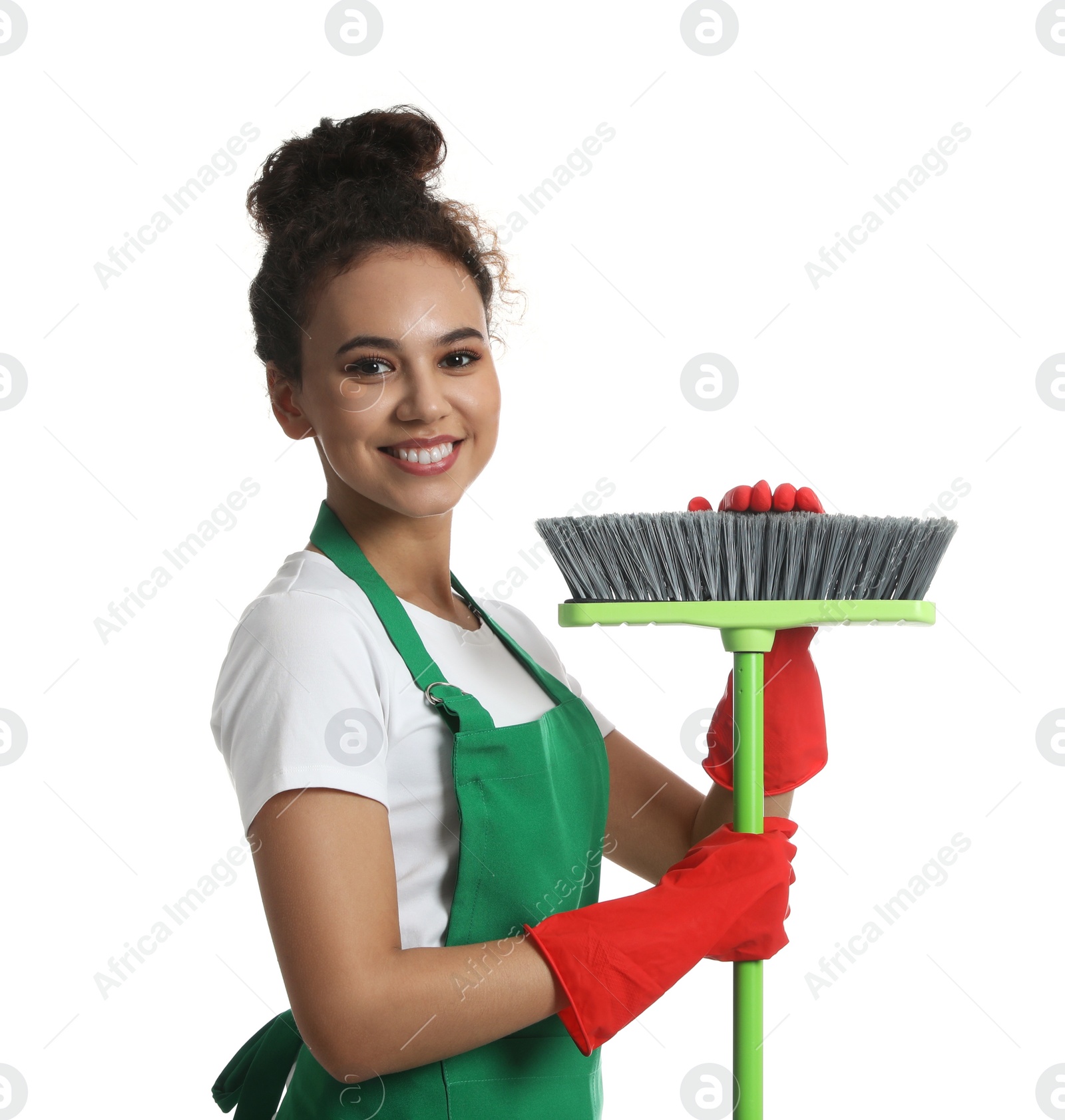 Photo of African American woman with green broom on white background