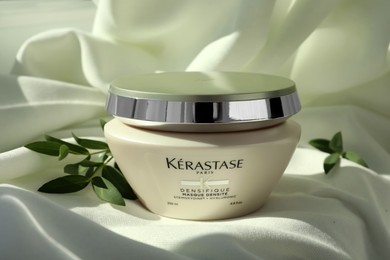 MYKOLAIV, UKRAINE - SEPTEMBER 07, 2021: Kerastase hair care mask on white fabric